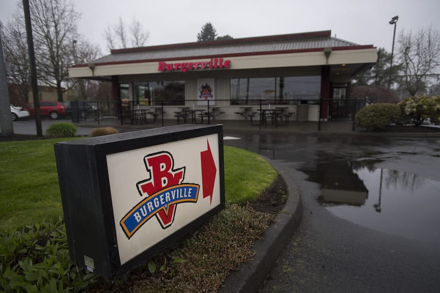 A sign directs customers to the Burgerville restaurant on Southeast Mill Plain Boulevard.