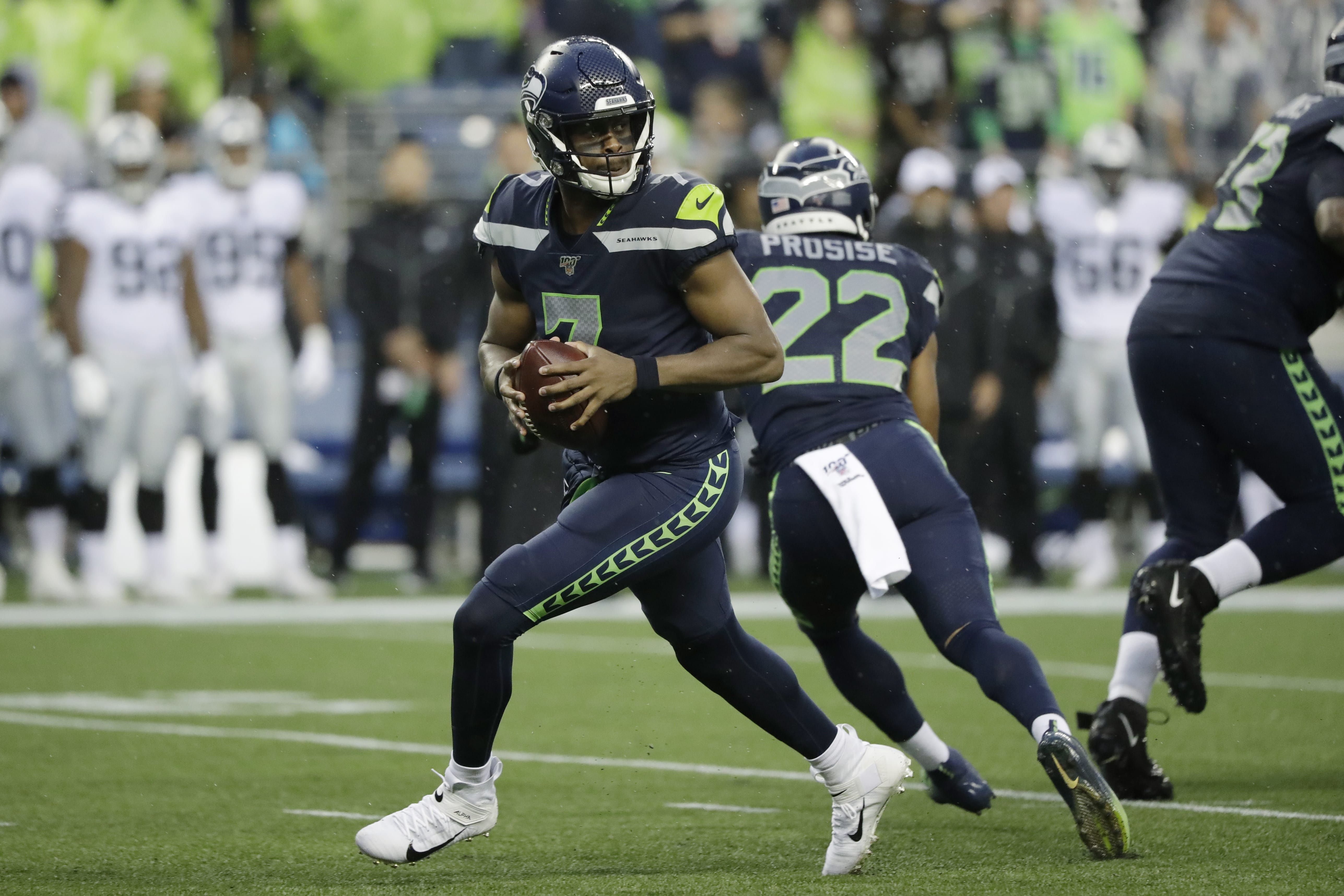 Seattle Seahawks quarterback Geno Smith drops back during the first half of the team's NFL football preseason game against the Oakland Raiders, Thursday, Aug. 29, 2019, in Seattle.