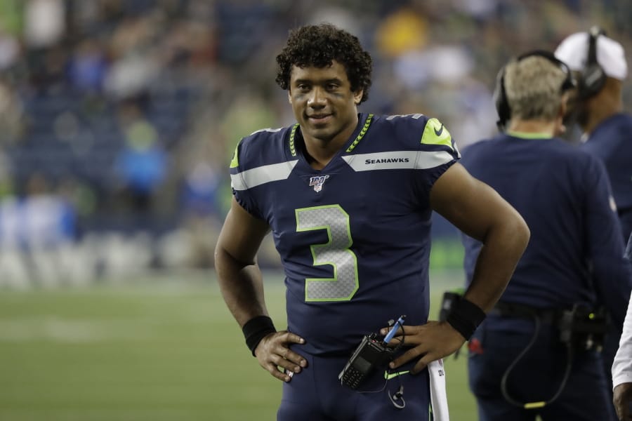 Seattle Seahawks quarterback Russell Wilson on the sideline against the Denver Broncos during the second half of an NFL football preseason game, Thursday, Aug. 8, 2019, in Seattle.