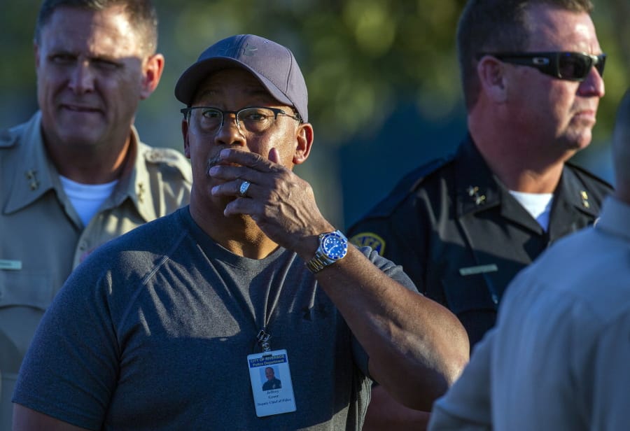 Riverside City Deputy Chief of Police Jeffrey Greer reacts at the scene where a shootout near a freeway killed a California Highway Patrol officer and wounded two others before the gunman was fatally shot, Monday, Aug. 12, 2019, in Riverside, Calif.