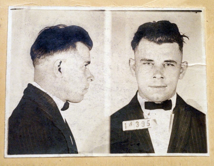 FILE - This file photo shows Indiana Reformatory booking shots of John Dillinger, stored in the state archives, and shows the notorious gangster as a 21-year-old. Records show that Dillinger was admitted into the reformatory on Sept. 16, 1924. The body of the 1930s gangster is set to be exhumed from an Indianapolis cemetery more than 85 years after he was killed by FBI agents. The Indiana State Department of Health approved a permit July 3, 2019, that Dillinger’s nephew, Michael C.