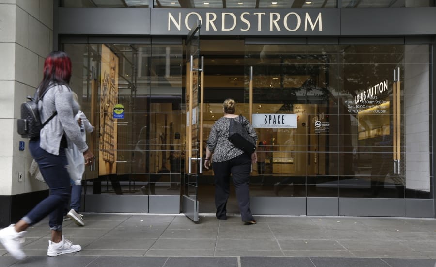 Shoppers enter Nordstrom’s flagship store in downtown Seattle in 2017.