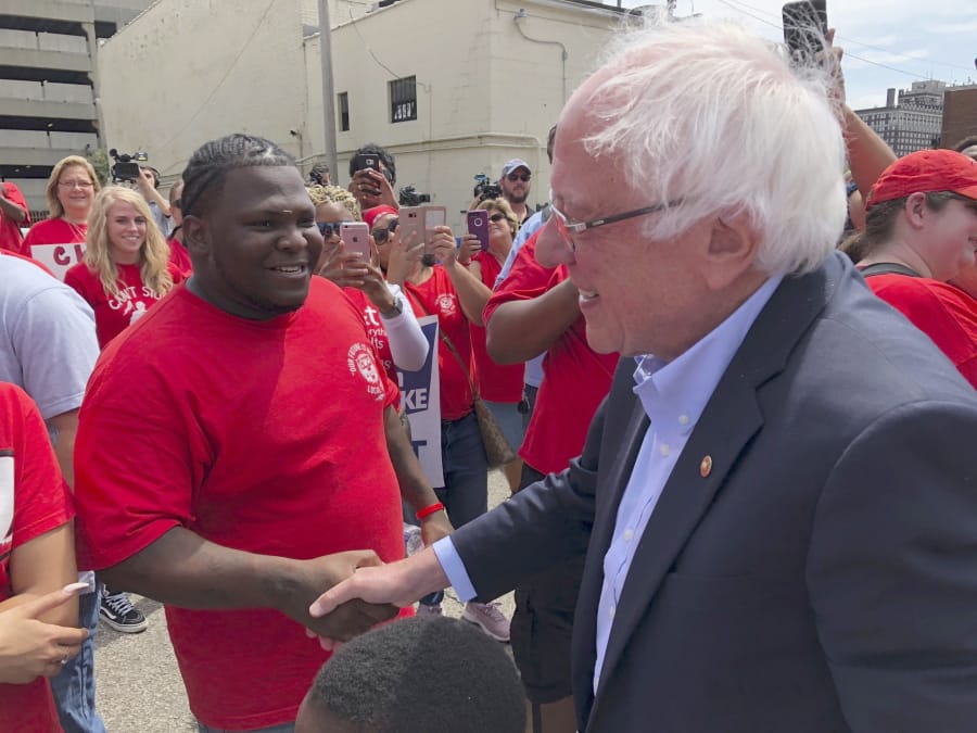 Democratic presidential candidate Sen. Bernie Sanders greets striking telecommunications workers on Sunday, Aug. 25, 2019, during a stop in Louisville, Ky. Sanders spoke to the striking workers before attending a rally to promote Democratic initiatives being bottled up in the Republican-led Senate.