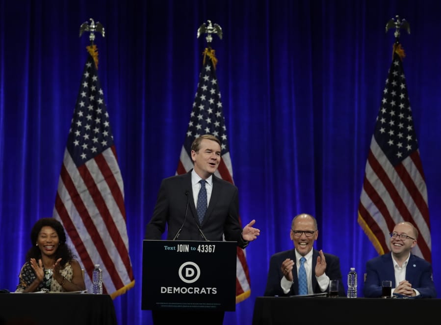 Democratic presidential candidate Sen. Michael Bennet, D-Colo., gestures while speaking at the Democratic National Committee’s summer meeting Friday, Aug. 23, 2019, in San Francisco. More than a dozen Democratic presidential hopefuls are making their way to California to curry favor with national party activists from around country. Democratic National Committee members will hear Friday from top contenders, including Elizabeth Warren, Kamala Harris and Bernie Sanders.