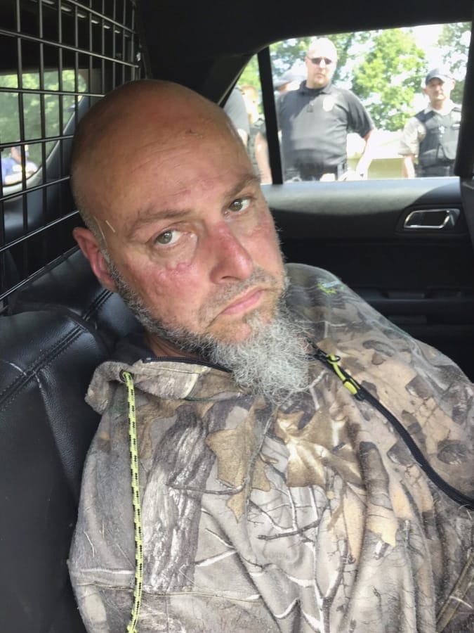 Authorities say Ray Watson, a convict suspected of killing a corrections administrator before escaping prison on a tractor, has been captured.