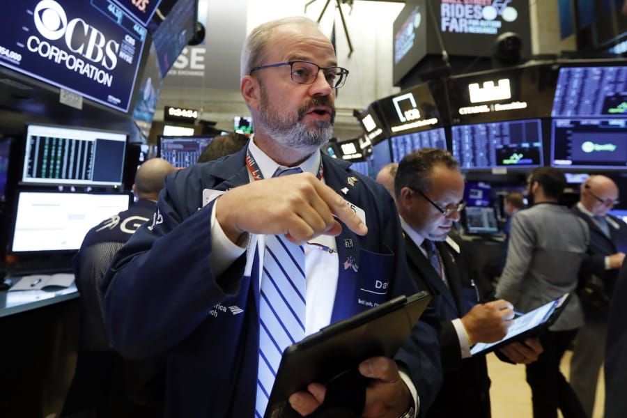 Trader David O’Day works on the floor of the New York Stock Exchange, Monday, Aug. 19, 2019. Technology stocks were leading indexes higher on Wall Street after the U.S. gave Chinese telecom giant Huawei another 90 days to buy equipment from American suppliers.