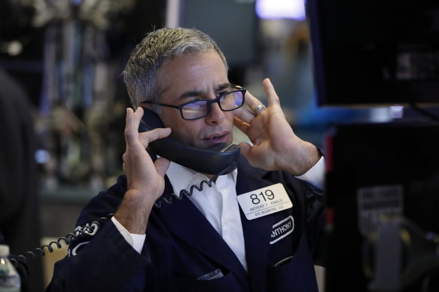 Specialist Anthony Rinaldi works on the floor of the New York Stock Exchange, Friday, Aug. 9, 2019. Stocks moved broadly lower in early trading On Wall Street Friday as investors again retreated to safer holdings in a market racked by fear and anxiety over trade disputes.