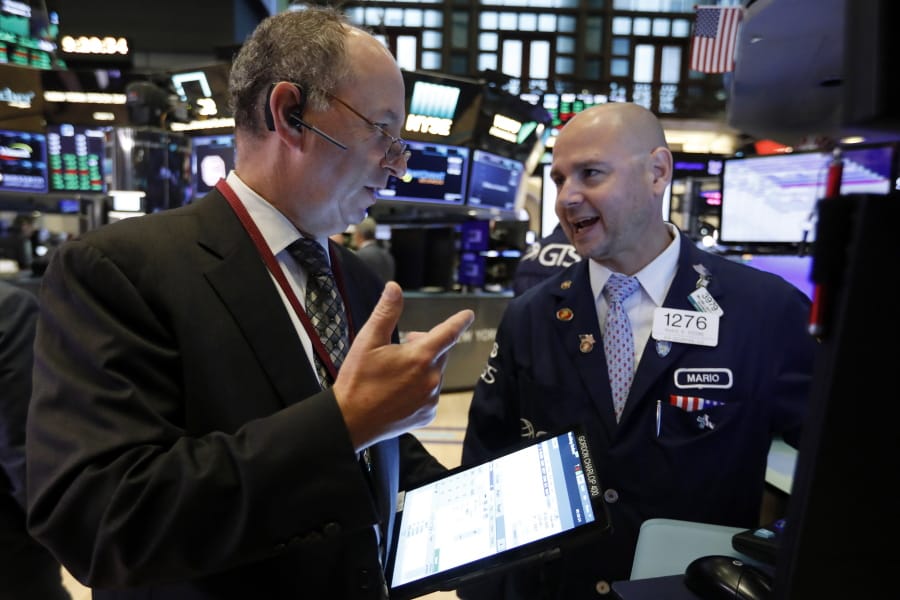 Trader Gordon Charlop, left, and specialist Mario Picone work on the floor of the New York Stock Exchange, Thursday, Aug. 8, 2019. Stock prices rose Thursday as investors braced for the next development in the U.S.-Chinese trade war, which has caused volatility in world markets this week, and after Beijing reported a rise in exports, easing some concerns about its economic slowdown.