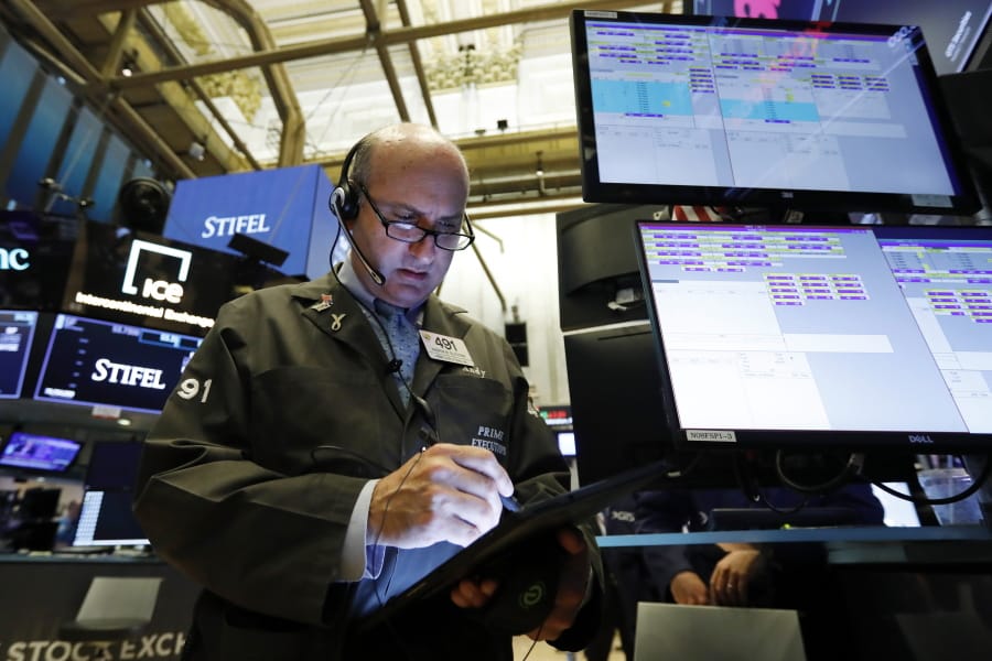 Trader Andrew Silverman works on the floor of the New York Stock Exchange, Tuesday, Aug. 6, 2019. Stock markets turned higher on Tuesday as China stabilized its currency after allowing it to depreciate against the dollar in response to President Donald Trump’s decision to put more tariffs on Chinese goods.