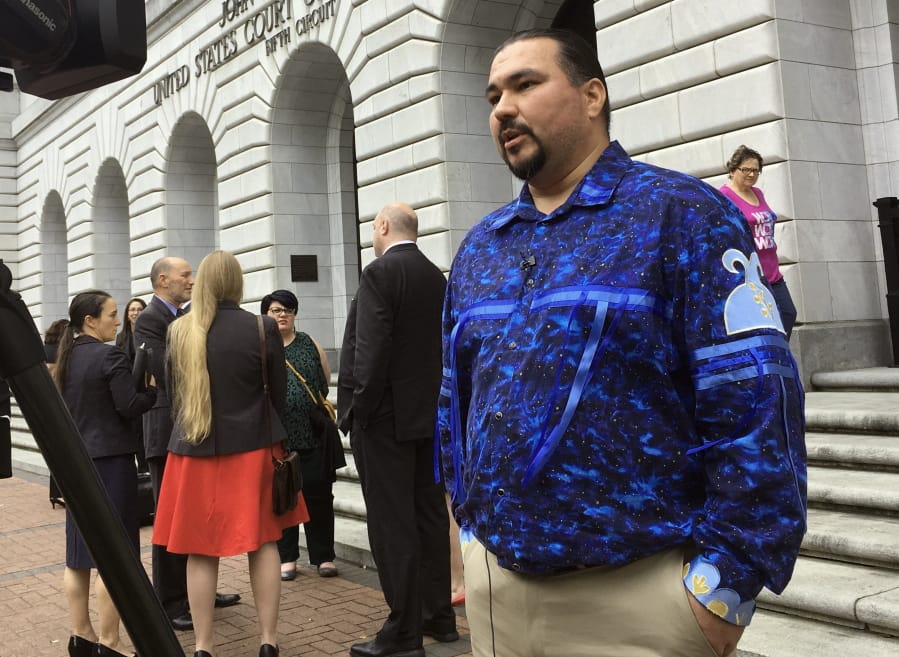 Tehassi Hill, tribal chairman of the Oneida Nation, stands outside a federal appeals court in New Orleans on March 13, following arguments on the constitutionality of a 1978 law giving Native American families preference in adoption of Native American children.