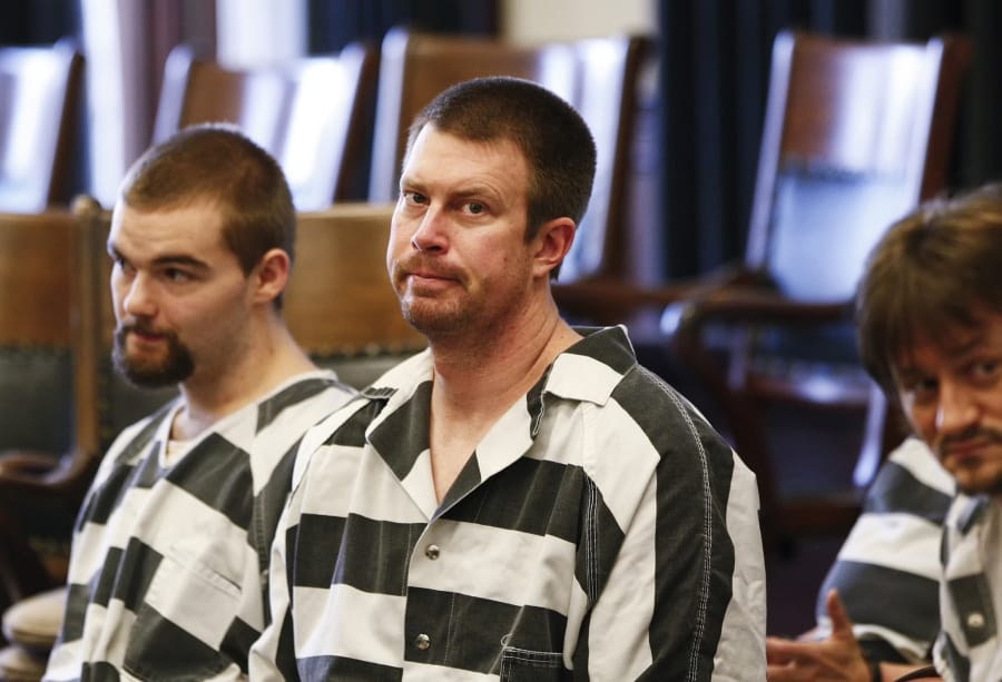 Ryan Leaf, center, sits in a Cascade County courtroom in Great Falls, Mont., in 2012. Ryan Leaf spent most of his time in prison alone and angry until a military veteran persuaded him to stop self-loathing long enough to help fellow inmates learn to read.