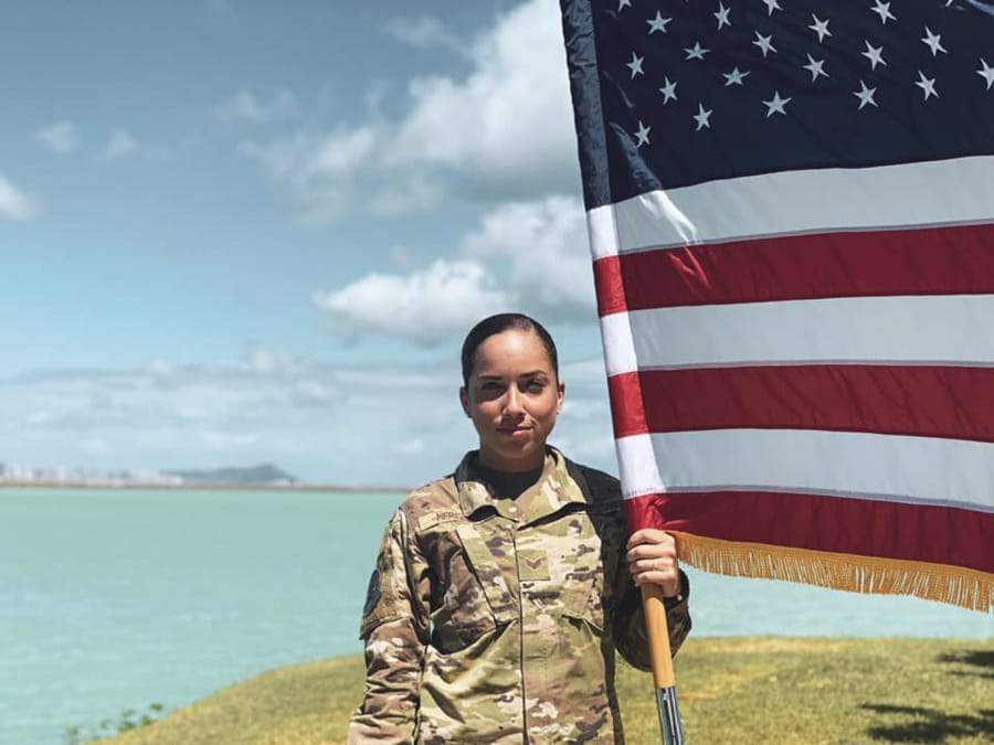 In this June 2019, photo, U.S. Air Force Senior Airman Xiara Mercado stands at Pearl Harbor, Hawaii. A Facebook post by Mercado, of Puerto Rico, drew wide attention when she described a recent encounter at a Honolulu Starbucks with a woman who complained about her talking in Spanish on the phone. Mercado wouldn't comment on recent anti-Latino violence that has terrified many Hispanics, but insisted people should speak up when they suffer discrimination.