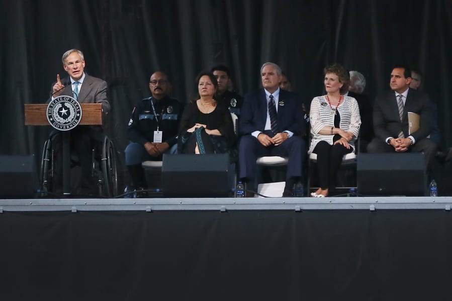 Texas Gov. Greg Abbott speaks at a community memorial service, Wednesday, Aug. 14, 2019, at Southwest University Park, in El Paso, Texas, for the people killed in a mass shooting on Aug. 3.