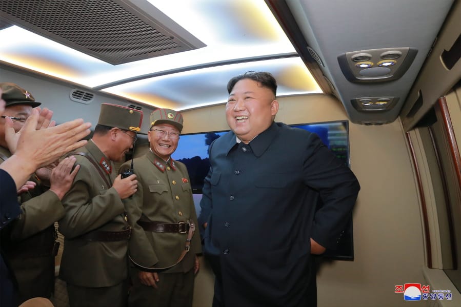 In this Tuesday, Aug. 6, 2019, photo provided by the North Korean government, North Korean leader Kim Jong Un, right, visits an airfield in the western area of North Korea to watch its weapons demonstrations. North Korea continued to ramp up its weapons demonstrations by firing two presumed short-range ballistic missiles into the sea Tuesday while lashing out at the United States and South Korea for continuing military exercises that the North says could derail fragile nuclear diplomacy. Independent journalists were not given access to cover the event depicted in this image distributed by the North Korean government. The content of this image is as provided and cannot be independently verified. Korean language watermark on image as provided by source reads: “KCNA” which is the abbreviation for Korean Central News Agency.