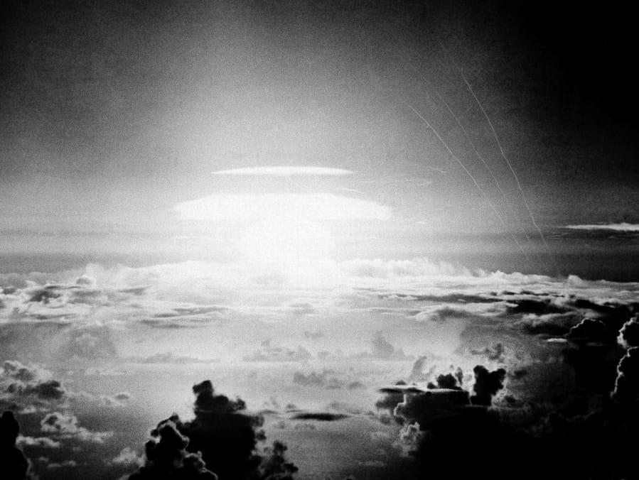 The fireball of a hydrogen bomb lights the Pacific sky over Bikini Atoll on May 21, 1956. The nuclear test resulted in the contamination of a Pacific island chain.