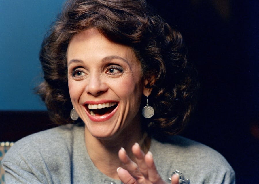 FILE - In this Jan. 1987 file photo, Actress Valerie Harper laughs during an interview in New York. Valerie Harper, who scored guffaws and stole hearts as Rhoda Morgenstern on back-to-back hit sitcoms in the 1970s, has died, Friday, Aug. 30, 2019. She was 80.