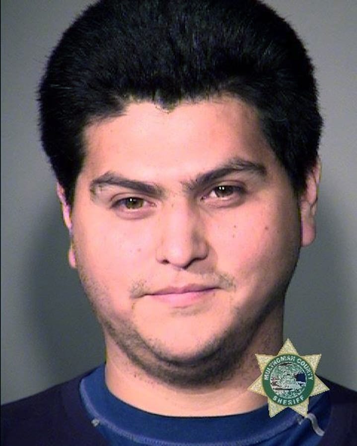 In this undated Multnomah County Sheriff photo is Antonio Scott Zamora. The Portland Police Bureau on Tuesday, Aug. 27, 2019, arrested another person in the aftermath of a protest and counter-protest that led to clashes between right-wing and left-wing demonstrators. Court documents say Antonio Scott Zamora was in a crowd of masked anti-fascist demonstrators who surrounded a bus carrying the far-right groups Proud Boys and Patriot Prayer. Authorities say Zamora, who was later identified by his teal-colored shirt and rainbow-colored face mask, hit the bus and threw an object at its window. Several videos of the attack on the bus, which was stopped in heavy traffic, went viral in the days after the Aug. 17 protest.
