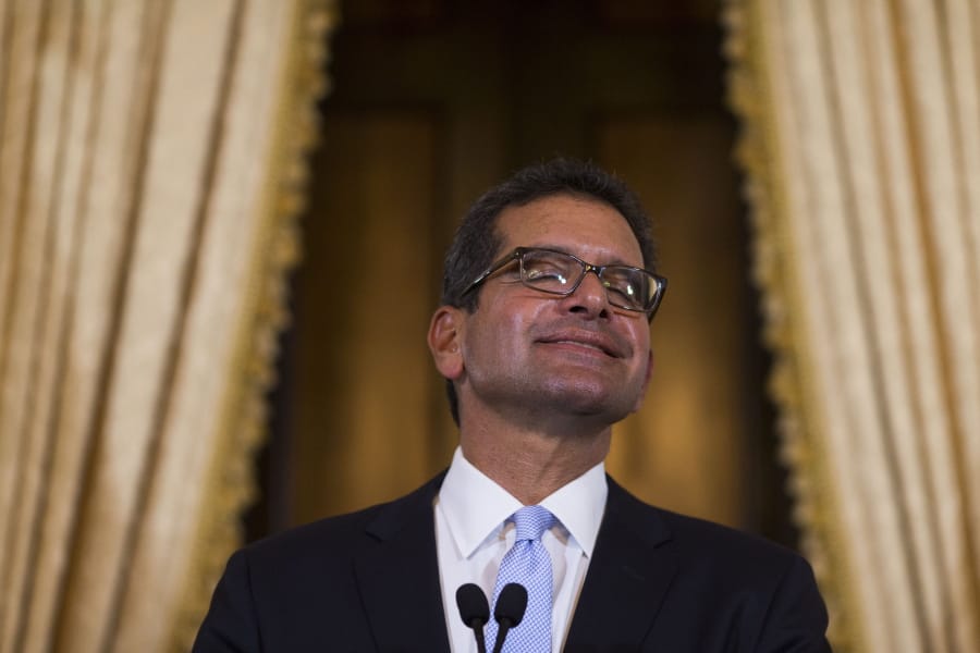 Pedro Pierluisi, sworn in as Puerto Rico’s governor, smiles during a press conference Friday in San Juan, Puerto Rico. Dennis M.