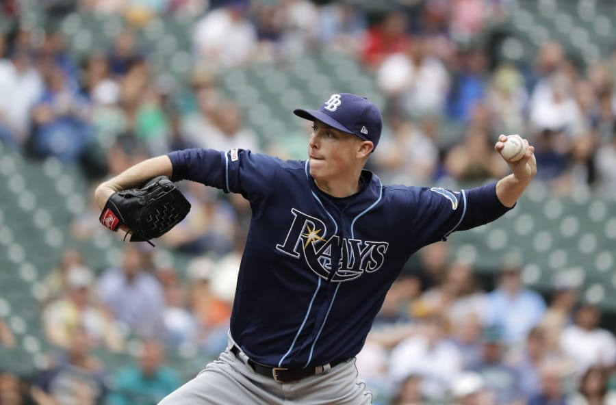 Tampa Bay Rays starting pitcher Ryan Yarbrough throws against the Seattle Mariners during the first inning of a baseball game, Sunday, Aug. 11, 2019, in Seattle. (AP Photo/Ted S.