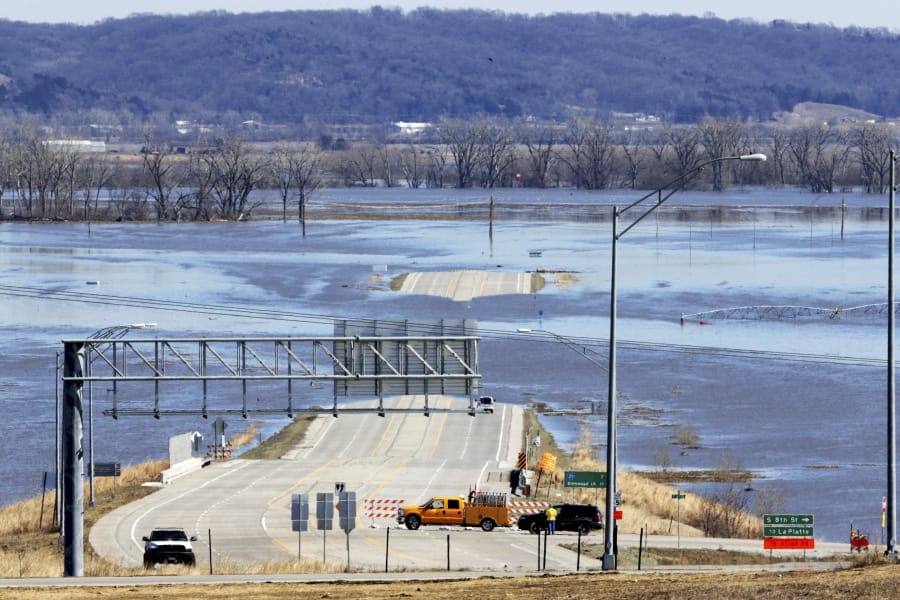 Nebraska Department of Roads crews block the flooded Highway 34 that connects Platteview, Neb., to I-29 on March 16 in Iowa. After devastating flooding in 2019, Iowa put $15 million into a special fund to help local governments recover and guard against future floods.