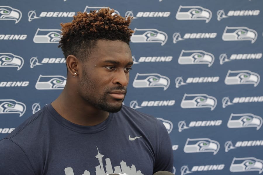 FILE - In this July 29, 2019, file photo, Seattle Seahawks wide receiver DK Metcalf talks to reporters at NFL football training camp in Renton, Wash. L.J. Collier has been out for weeks, Metcalf just underwent surgery and Marquise Blair has a sore back. The Seattle Seahawks still have high hopes for their draft class but many aren’t even on the field currently(AP Photo/Ted S.
