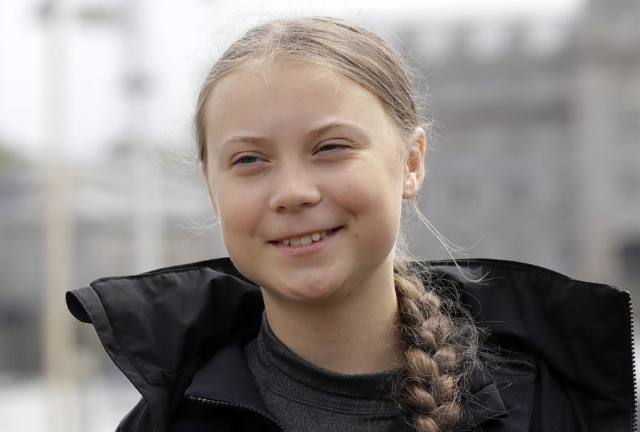 FILE - In this Aug. 14, 2019 file photo, Climate change activist Greta Thunberg addresses the media during a news conference in Plymouth, England. Thunberg has crossed the Atlantic on a zero-emissions sailboat to attend a conference on global warming. On Wednesday, Aug. 28, before dawn, Thunberg tweeted, “Land!!