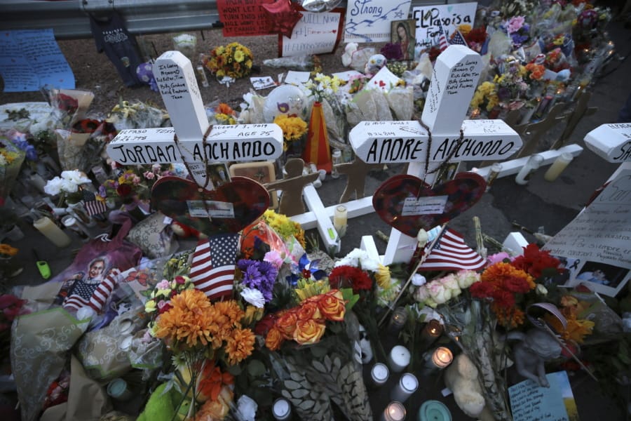 Crosses bear the names of the people killed at a Walmart Saturday during a memorial Monday, Aug. 5, 2019, in El Paso, Texas.