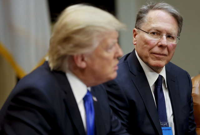 In a Feb. 1, 2017, file photo, National Rifle Associations (NRA) Executive Vice President and Chief Executive Officer Wayne LaPierre listens at right as President Donald Trump speaks in the Roosevelt Room of the White House in Washington. In the latest national furor over mass killings, the tremendous political power of the NRA is likely to stymie any major changes to gun laws. The man behind the organization is LaPierre, the public face of the Second Amendment with his bombastic defense of guns, freedom and country in the aftermath of every mass shooting.