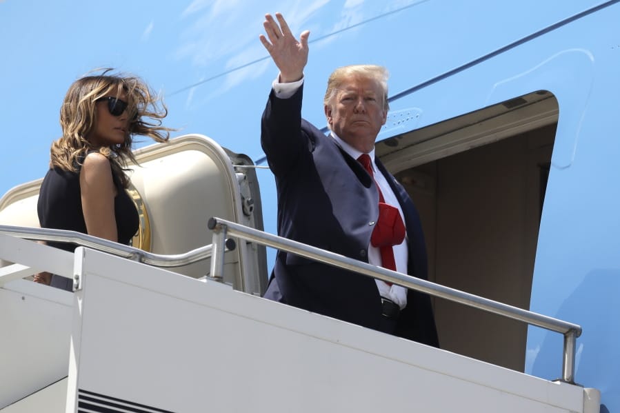 President Donald Trump and first lady Melania Trump board Air Force One at Wright-Patterson Air Force Base after meeting with people affected by the mass shooting in Dayton, Ohio, Wednesday, Aug. 7, 2019, at Wright-Patterson Air Force Base, Ohio.