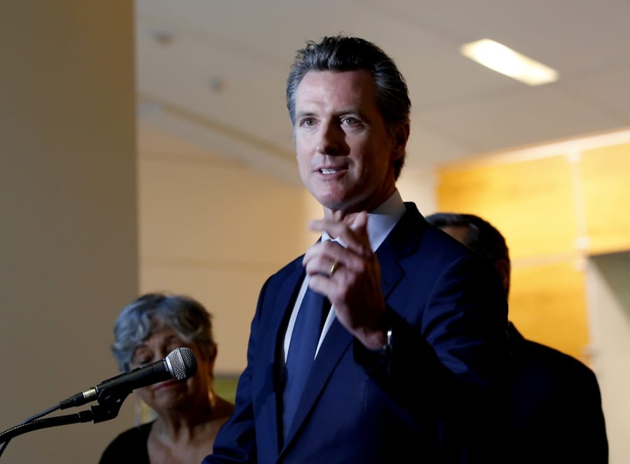 California Gov. Gavin Newsom answers questions regarding the lawsuit the state has joined in with 21 other Democrat-led states against the Trump administration over its decision to ease restrictions on coal-fired power plants, during a news conference in Sacramento, Calif., Tuesday Aug. 13, 2019. The lawsuit, filed in the U.S. Court of Appeals for the District of Columbia Circuit, says the new rule violates the federal Clean Air Act because it does not meaningfully replace power plants’ greenhouse gas emissions.