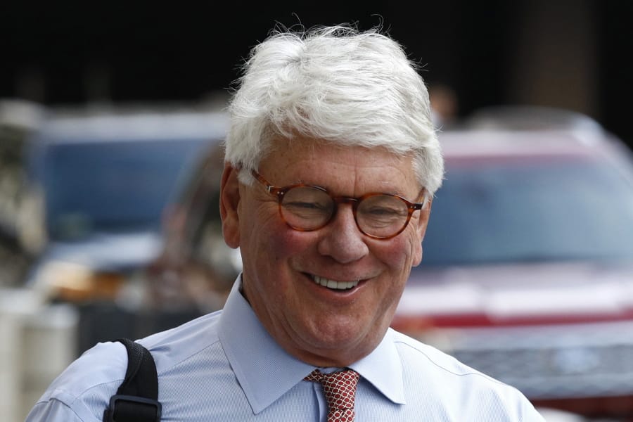 Greg Craig, former White House counsel to former President Barack Obama, walks into a federal courthouse for his trial, Thursday, Aug. 22, 2019, in Washington.
