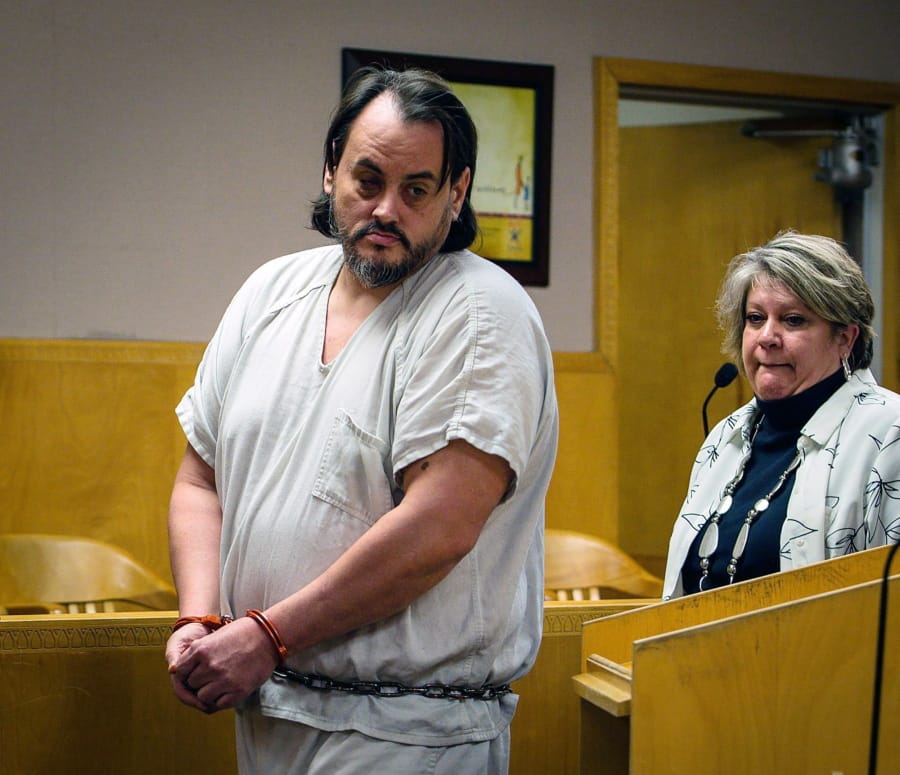 In this Feb., 15, 2019 photo, Zachary David O’Neill, left, walks into court with his lawyer Kris Copenhaver for his arraignment on charges of attempted murder and rape in Billings, Mont. On Friday, Aug. 23, 2019 O’Neill, 39, is expected to be sentenced to life in prison after pleading guilty last month to murder and the attempted killing and rape of another victim during the same time period.