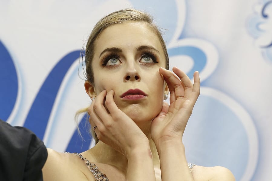 FILE - In this Jan. 5, 2018, file photo, Ashley Wagner waits for her scores during the women’s free skate event at the U.S. Figure Skating Championships in San Jose, Calif. Former Olympian Ashley Wagner says she was sexually assaulted by another figure skater in 2008 when she 17. The three-time national champion writes in USA Today on Thursday, Aug. 1, 2019, that John Coughlin climbed into her bed after a party at a skating camp and began kissing and groping her. Coughlin was 22 at the time and took his life in January at 33.