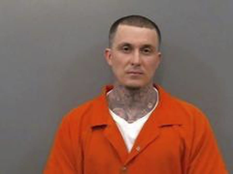 In this undated booking photo provided by the Jefferson County, Ark., Sheriff’s Office, Wednesday, July 31, 2019 shows Wesley Gullett. Gullett, a leader of a white supremacist gang in Arkansas and another inmate, Christopher Sanderson, have escaped a local jail and are being sought by authorities who say they consider the men armed and dangerous. The U.S. Marshals service said Tuesday, July 30, 2019 authorities were searching for Gullett and Sanderson after the pair escaped from the Jefferson County Detention Center in Pine Bluff, which is about 38 miles south of Little Rock.