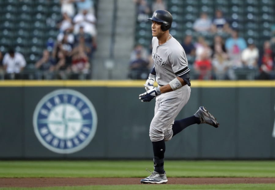 New York Yankees’ Aaron Judge rounds the bases on his two-run home run against the Seattle Mariners during the first inning of a baseball game Tuesday, Aug. 27, 2019, in Seattle.