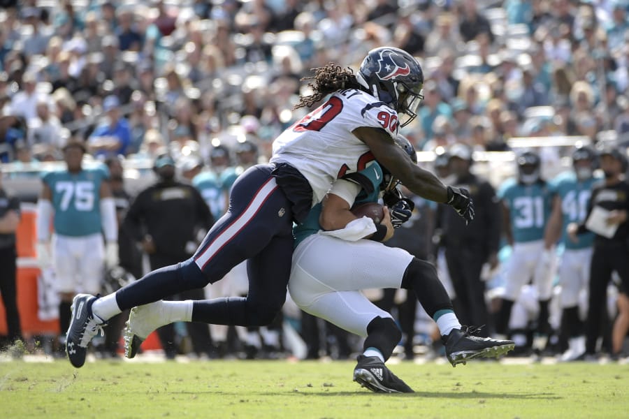 The Seattle Seahawks completed a trade with the Houston Texans to acquire linebacker Jadeveon Clowney (90) for a third-round pick and two players on Sunday, Sept. 1, 2019. (AP Photo/Phelan M.