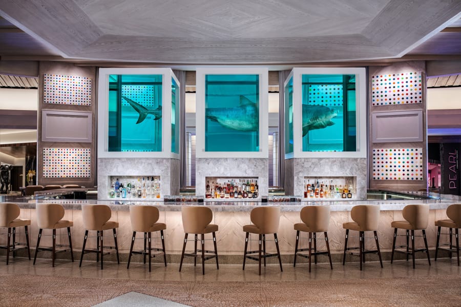 Damien Hirst’s sculpture of a 13-foot tiger shark preserved in three tanks floats atop the The Palms’ Unkown Bar and also inspired the name of Bobby Flay’s new restaurant.