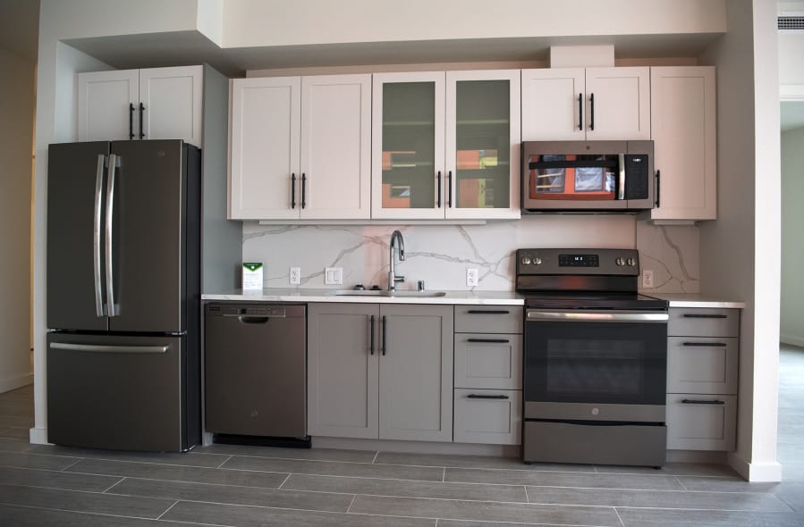 The kitchen area of a two-bedroom apartment on the fourth floor of the Rediviva apartment complex offers deluxe appliances.