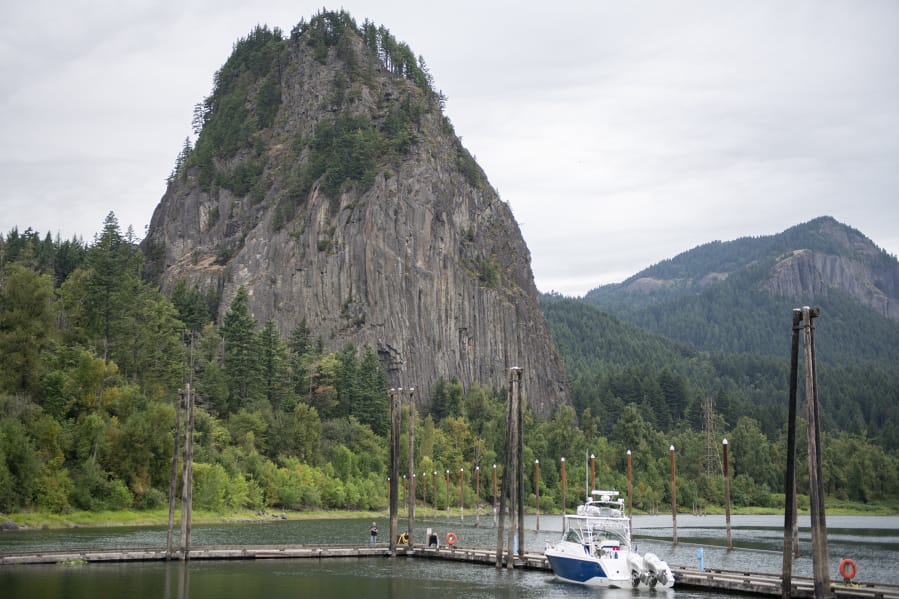 A fisherman casts his reel into the Columbia River from the dock at the Doetsch day-use area at Beacon Rock State Park.