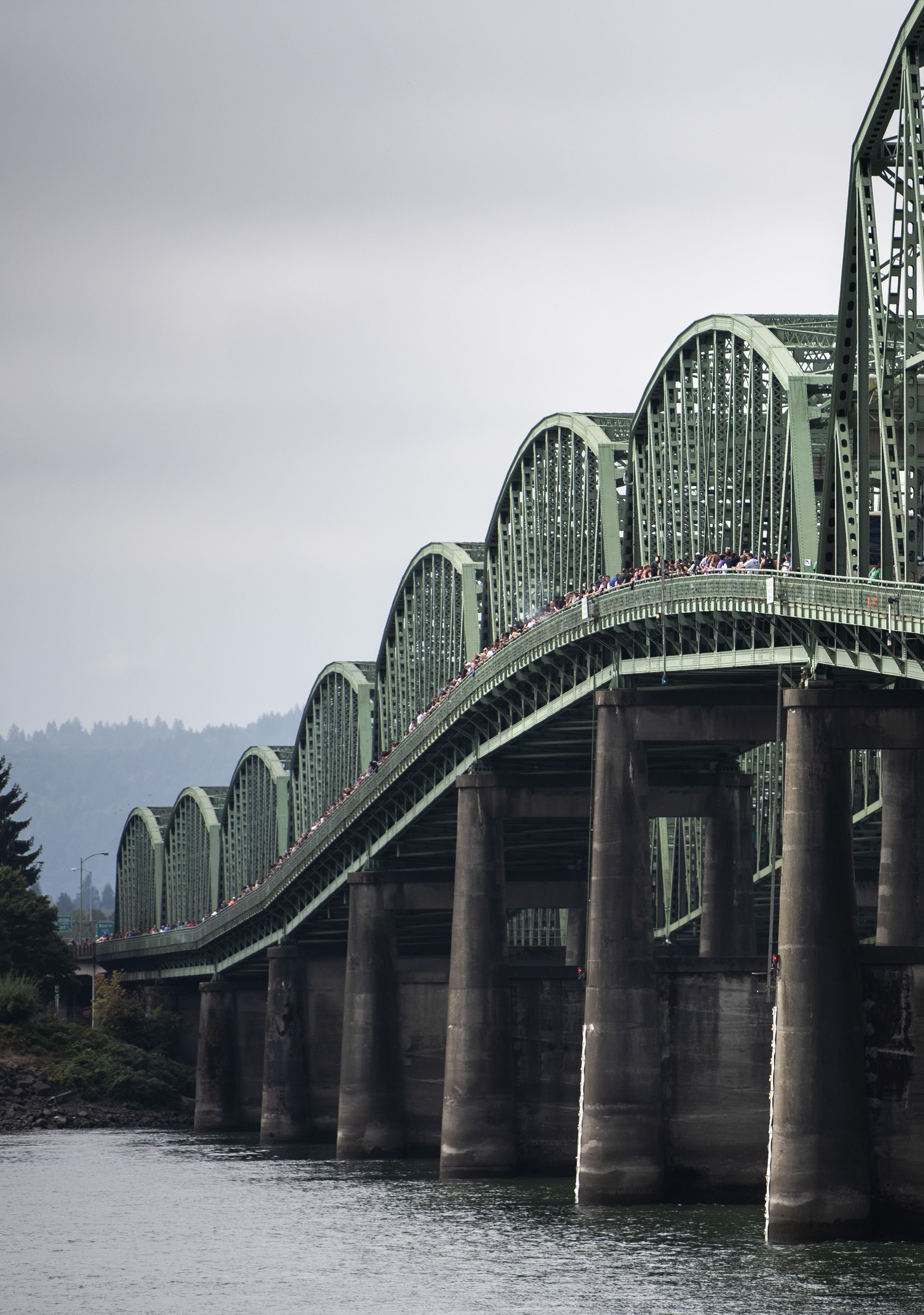 Attendees make their way across the I-5 bridge to meet people walking from the Oregon side during the Hands Across the Bridge event on Monday, September 2, 2019. This day marked the 19th anniversary of the event, in which people in recovery come together to share their stories and celebrate sobriety. More than 900 people from the Washington side of the Columbia River walked out onto the bridge to meet the attendees walking from the Oregon side.