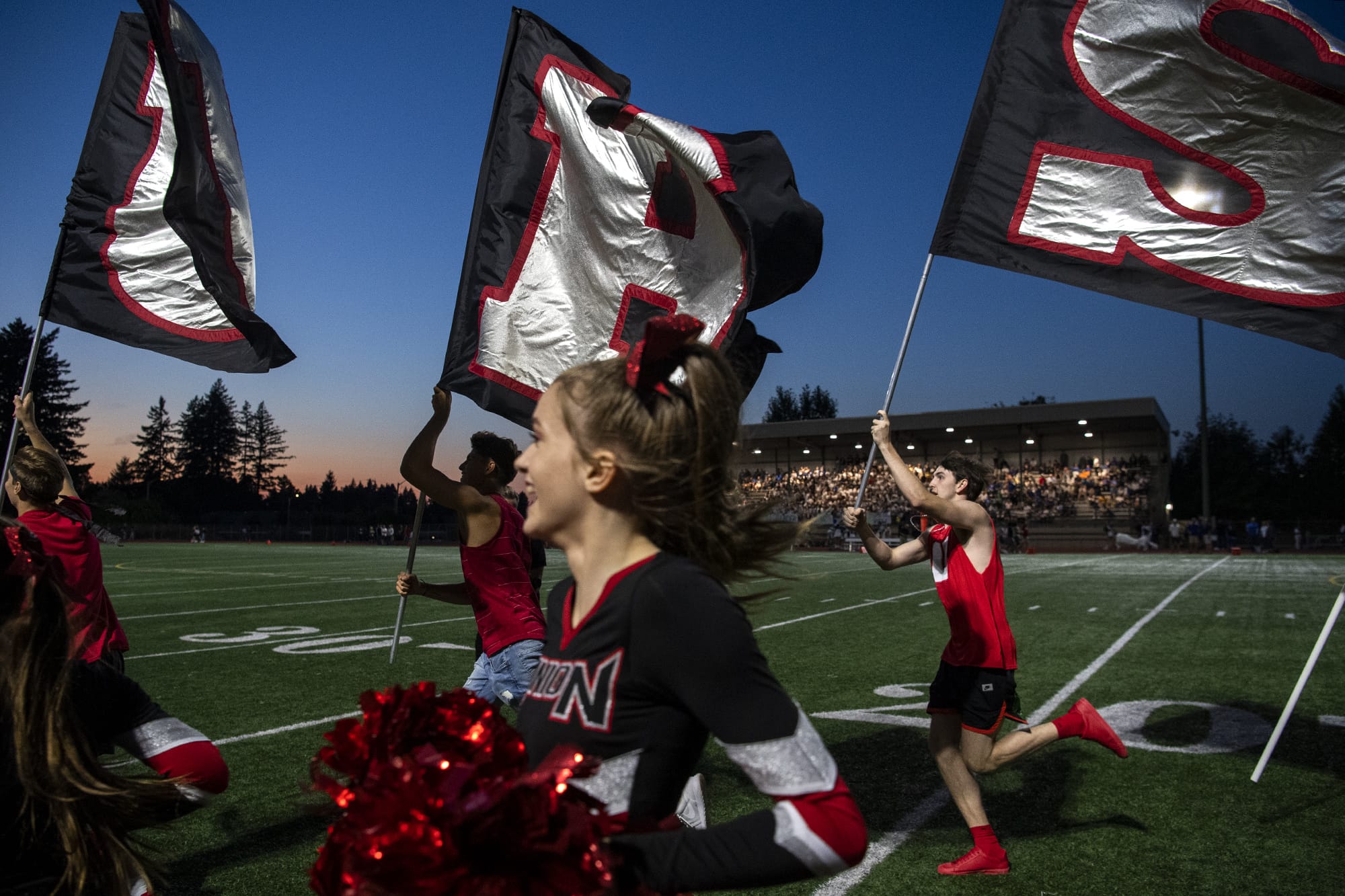 Union fans and cheerleaders rush onto the field with the team during Friday nightÕs game at McKenzie Stadium in Vancouver on Sept. 6, 2019.