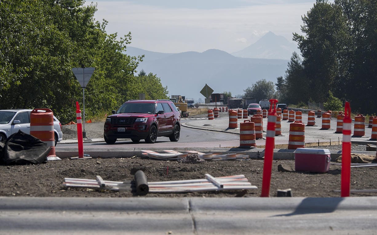 Drivers traveling west on State Highway 14 navigate the new roundabout at the intersection with Washougal River Road as Mount Hood is seen in the distance Sept. 3. Work on a second roundabout at 32nd Street will cause traffic delays starting Thursday.