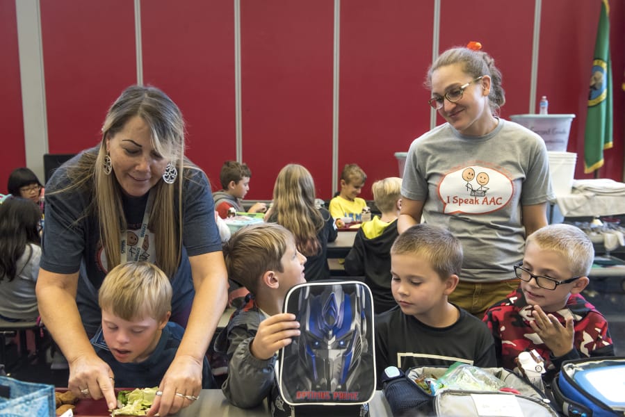 Amy Campbell, standing at right, is a special education teacher at Helen Baller Elementary School and the 2020 Washington State Teacher of the Year. Campbell, seen visiting with students at lunch period Monday, said she is focused on including her special education students in with the rest of the school to build community, empathy and relationships.