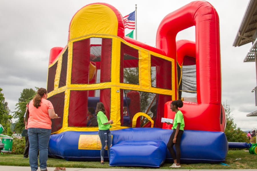 In addition to handing out backpacks filled with school supplies, Woodland Public Schools&#039; third annual Back to School Bash also allowed kids to play in bounce houses.