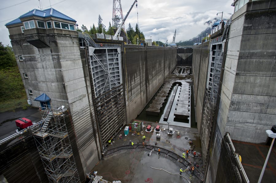 Contracted workers from Advanced American Construction work to replace the sill at Bonneville Navigation Lock on Wednesday morning. The U.S. Army Corps of Engineers hosted a tour at the lock to show off the emergency repair project.