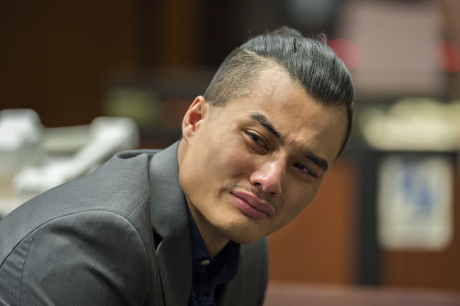 Mitchell Heng becomes emotional after hearing the guilty verdict in his murder trial in Clark County Superior Court on Thursday evening. In addition to first-degree murder, the jury convicted Heng of first-degree arson. He was acquitted of first-degree robbery.