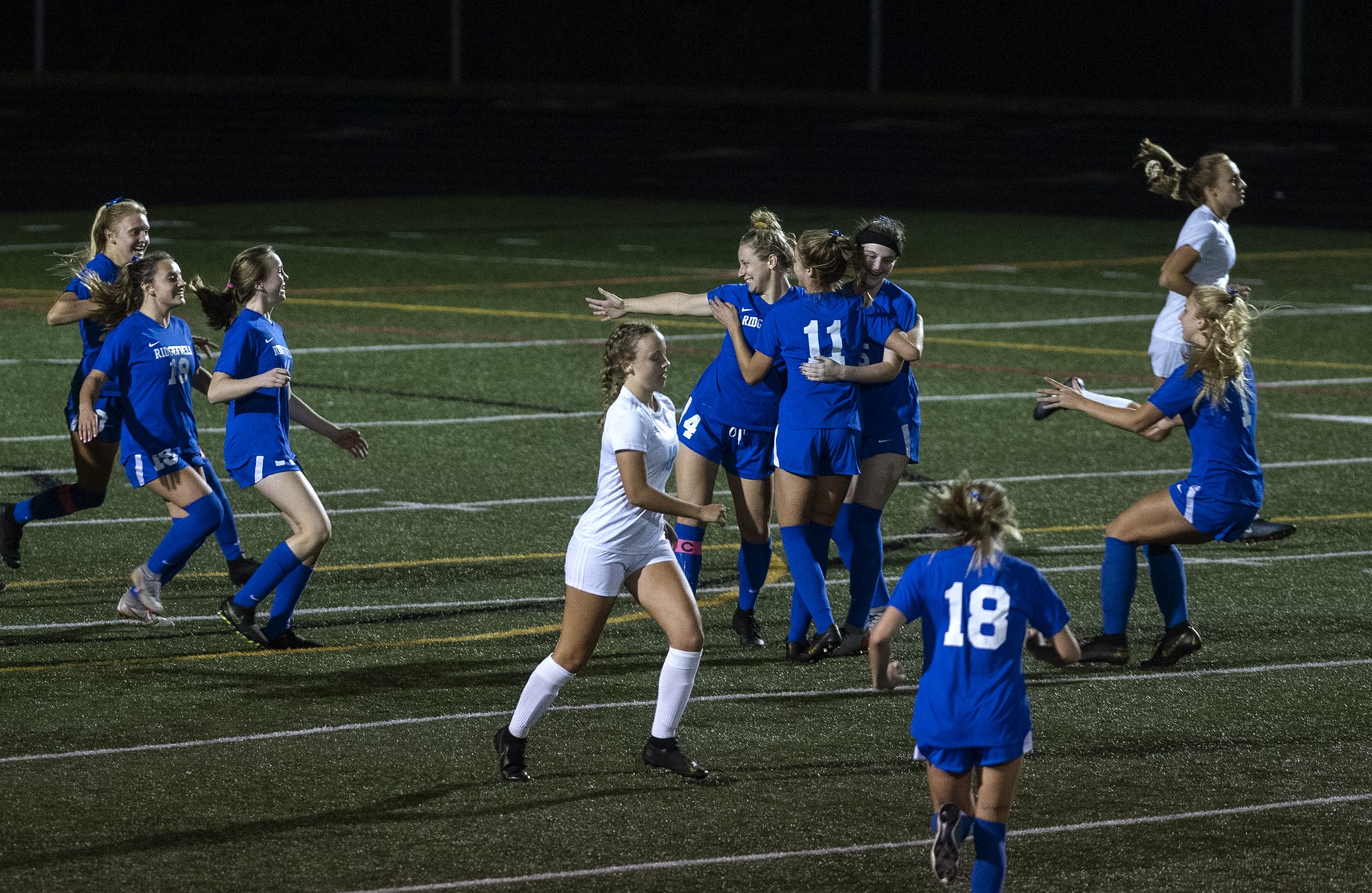 RidgefieldÕs Brooke Weese (4) center, celebrates a goal with her teams during Tuesday nightÕs game in Ridgefield on Sept. 24, 2019. Ridgefield won 4-0.
