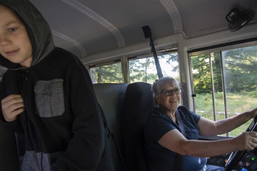 Debbie Proctor says goodbye to students as they get off her Green Mountain Elementary School bus in Woodland on her Wednesday afternoon route. Known as Ms. Debbie to students, Proctor, 65, is on her 34th year of driving for the school, which is the only school in its district.