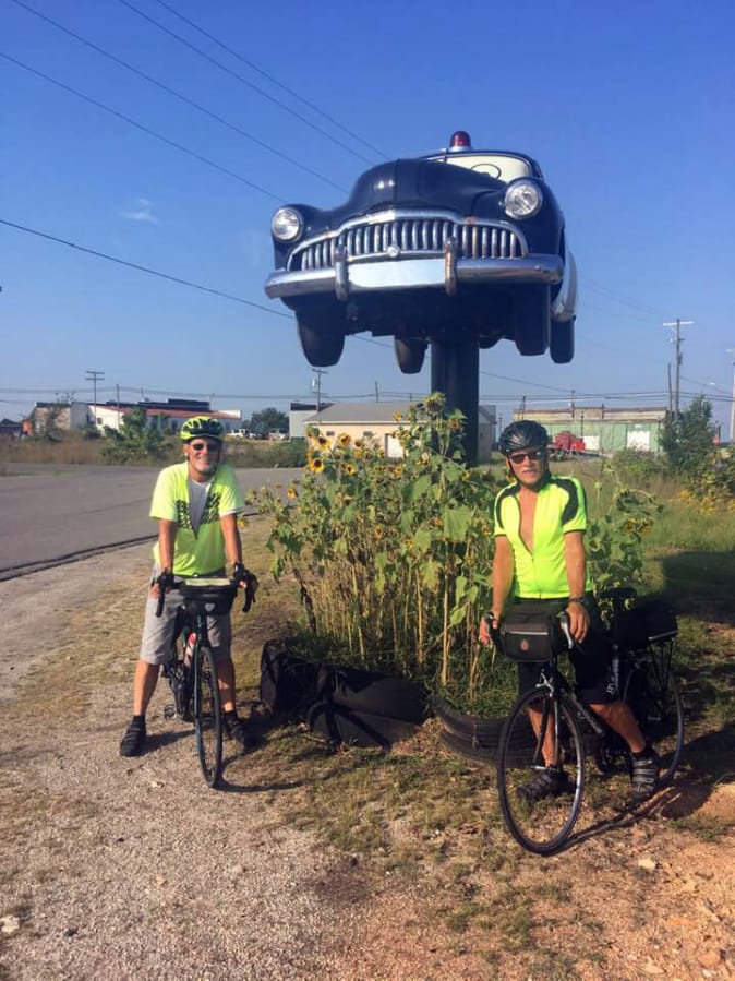 Brothers Mike, left, and Mark Roskam pose for a photo in Kansas during their cross-country cycling journey to raise funds for Open House Ministries. The trip was cut short after Mike Roskam was struck by a pickup in Oklahoma.