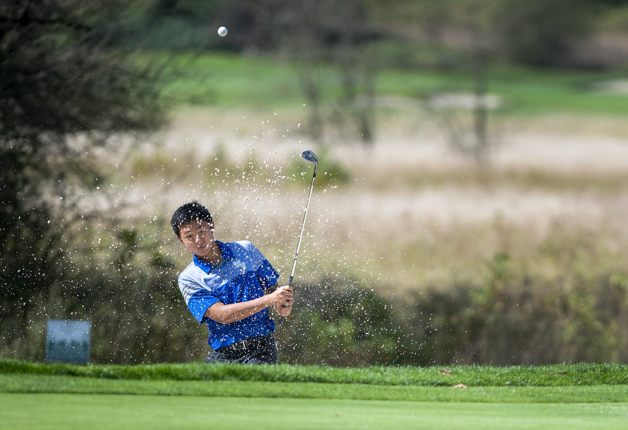 Mountain ViewÕs Willy Yeh hits from a sand trap during the Titan Cup golf tournament at Camas Meadows Golf Course on Sept. 16, 2019.